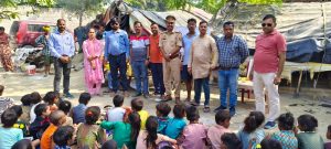 Guruji in khaki distributed study material, candles and sweets to the children of his school and wished them a Happy Diwali